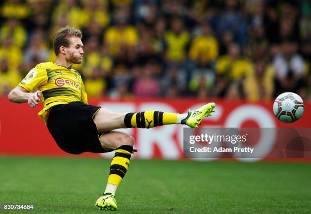Andre Schuerrle of Borussia Dortmund takes a shot during the DFB Cup match between 1. FC Rielasingen-Arlen and Borussia Dortmund at...