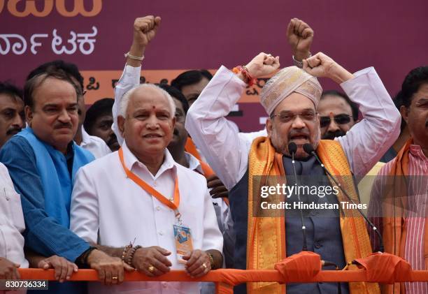 President Amit Shah with Karnataka BJP state President BS Yeddyurappa and Union Minister Ananth Kumar during a public rally near Devanahalli, on...