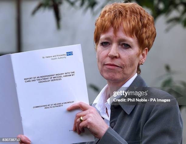 Lynda Abram with a copy of the report into her son Michael after a press conference about the care and treatment of Mr Abram from Liverpool, who...