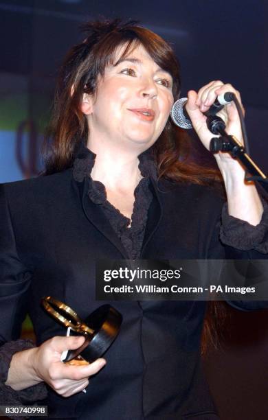 Singer Kate Bush receives the Classic Songwriter Award during The Q Awards 2001 at the Park Lane Hotel in London .