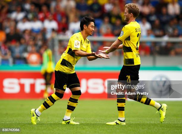 Shinji Kagawa of Borussia Dortmund substitutes Andre Schuerrle during the DFB Cup match between 1. FC Rielasingen-Arlen and Borussia Dortmund at...