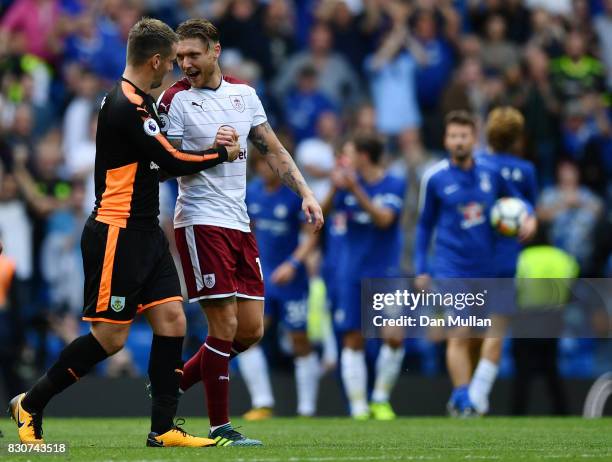 Thomas Heaton of Burnley and Jeff Hendrick of Burnley celebrate after the Premier League match between Chelsea and Burnley at Stamford Bridge on...