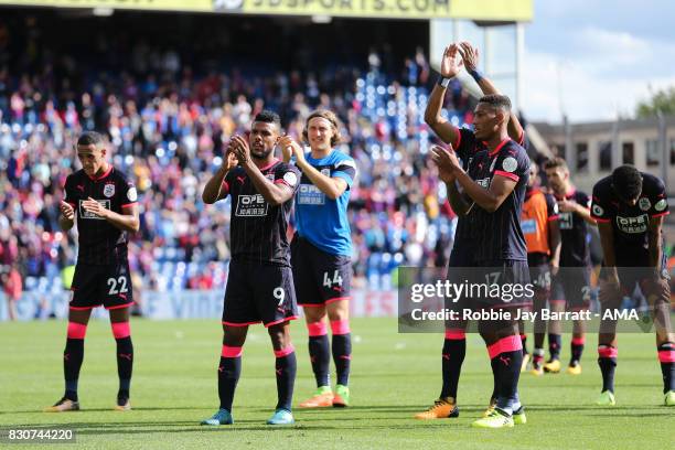 Huddersfield Town players celebrate with the fans at full time during the Premier League match between Crystal Palace and Huddersfield Town at...