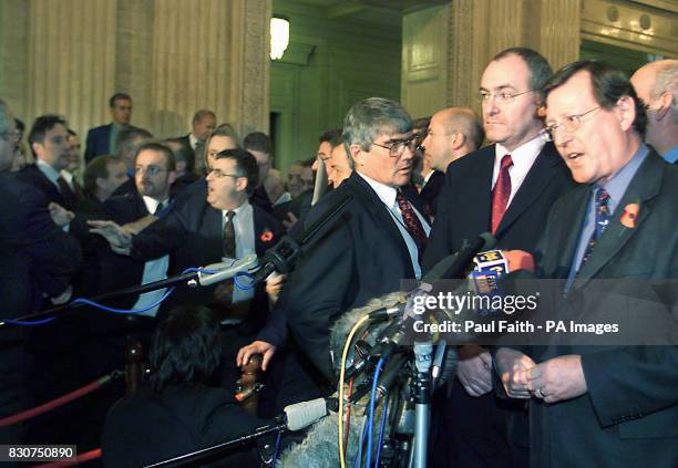 Newly elected First Minister David Trimble and Deputy First Minister Mark Durkan speak to the press in the Great Hall at Stormont, as rival Unionists...