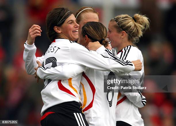 Ariane Hingst , Sandra Smisek and Simone Laudehr of Germany celebrate after the 3-0 during the 2009 UEFA European Championship Qualifying match...