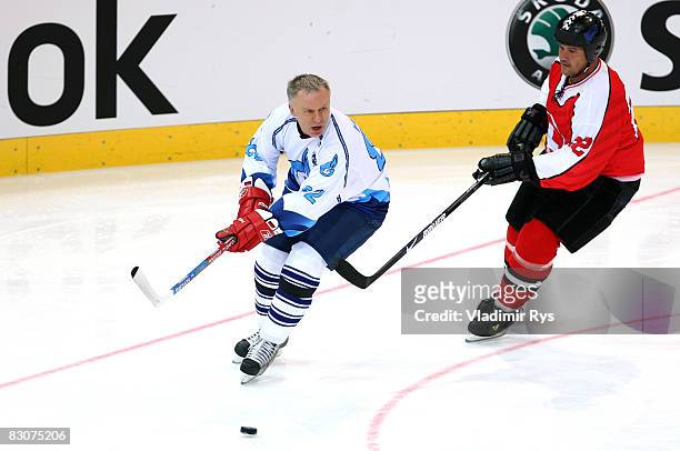 Viacheslav Fetisov of Russia and Marcel Wick of Switzerland are seen during the Victoria Cup Legends Match between Switzerland and Russia at the...