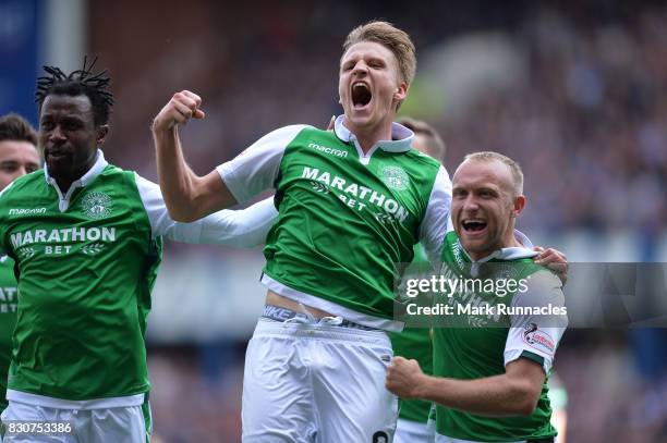 Vykintas Slivka , of Hibernian celebrates scoring with team mate Dylan McGeouch during the Ladbrokes Scottish Premiership match between Rangers and...