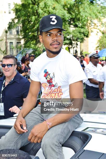 Chance The Rapper serves as Grand Marshal and donates 30,000 gift bags with school supplies at the 2017 Bud Billiken Parade on August 12, 2017 in...