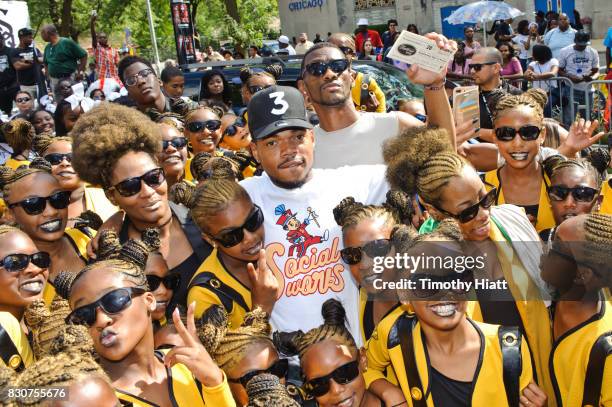 Chance The Rapper serves as Grand Marshal and donates 30,000 gift bags with school supplies at the 2017 Bud Billiken Parade on August 12, 2017 in...