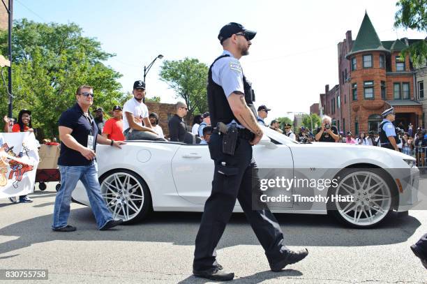 Chance The Rapper serves as Grand Marshal and donates 30,000 gift bags with school supplies at the 2017 Bud Billiken Parade on August 12, 2017 in...