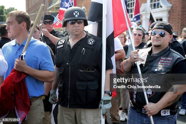 Hundreds of white nationalists, neo-Nazis and members of the "alt-right" march down East Market Street toward Emancipation Park during the "Unite the...