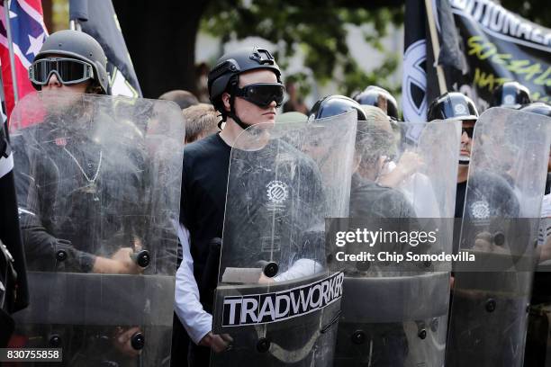 Hundreds of white nationalists, neo-Nazis and members of the "alt-right" march down East Market Street toward Emancipation Park during the "Unite the...