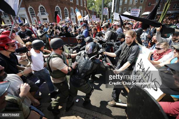 White nationalists, neo-Nazis and members of the "alt-right" clash with counter-protesters as they enter Emancipation Park during the "Unite the...