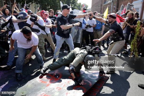 White nationalists, neo-Nazis and members of the "alt-right" clash with counter-protesters as they enter Emancipation Park during the "Unite the...