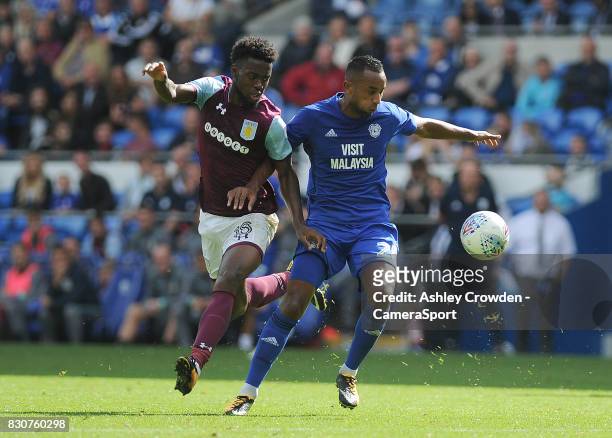 Aston Villa's Joshua Onomah vies for possession with Cardiff City's Loic Damour during the Sky Bet Championship match between Cardiff City and Aston...