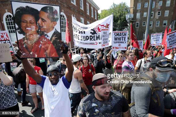 Counter-protesters line the route taken by white nationalists, neo-Nazis and members of the "alt-right" during the "Unite the Right" rally August 12,...