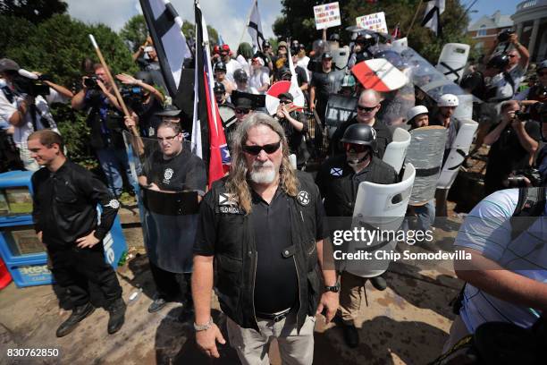 White nationalists, neo-Nazis and members of the "alt-right" exchange insluts with counter-protesters as they attempt to guard the entrance to...