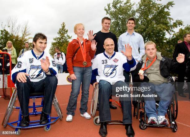 Vladimir Mihalik of the Tampa Bay Lightning, Czech bronze medal paralympian Marketa Mackova, Ryan Craig of the Tampa Bay Lightning, David Koci of the...