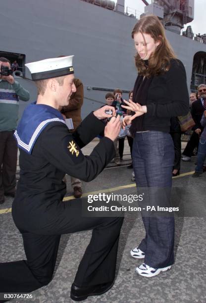 Operator mechanic Neil Talbot from HMS Ocean proposes to his girlfriend Emma Lowton after returning to Devonport docks in Plymouth. *The sailor and...