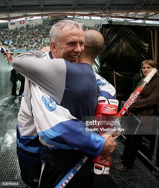 Russian ice hockey legend Viacheslav Fetisov speaks to a Rangers player Scott Gomez after the Victoria Cup Legends Match between Switzerland and...
