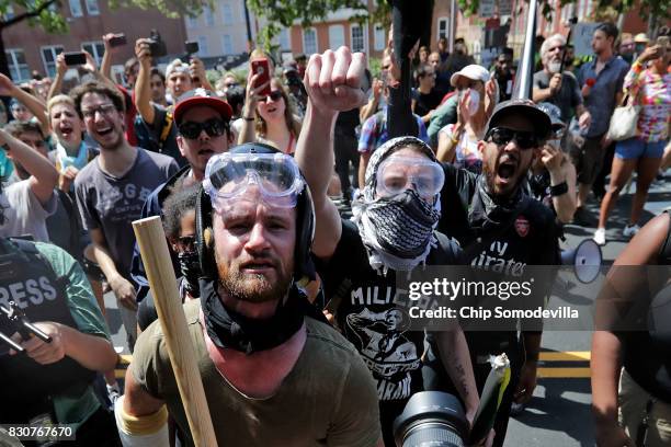 Anti-fascist counter-protesters wait outside Emancipation Park to hurl insluts as white nationalists, neo-Nazis and members of the "alt-right" are...