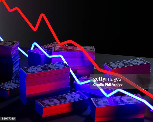 neon lights surrounded by piles of money - decadente foto e immagini stock