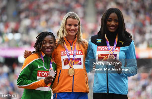 Marie-Josee Ta Lou of the Ivory Coast,silver, Dafne Schippers of the Netherlands, gold, and Shaunae Miller-Uibo of the Bahamas pose with their medals...