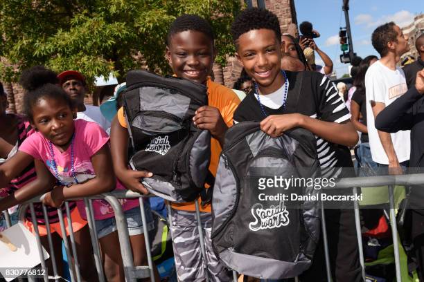 Children receive free backpacks during the 88th Annual Bud Billiken Parade on August 12, 2017 in Chicago, Illinois.
