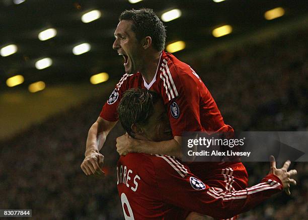 Robbie Keane of Liverpool celebrates scoring his team's second goal with team mate Fernando Torres during the UEFA Champions League Group D match...