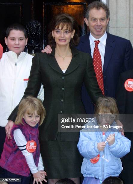 British Prime Minister Tony Blair and his wife Cherie stand with Matthew Bland age 13 from Oldham, Shannon Piggott age 6 from Staffordshire, bottom...