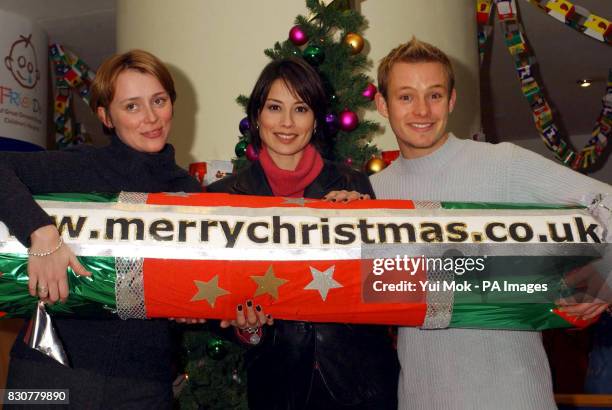 From left to right Actress Keeley Hawes, TV presenter Melanie Sykes and actor Adam Rickitt during the launch of the E-Card Christmas Appeal,...