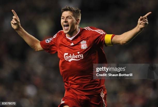Steven Gerrard of Liverpool celebrates scoring his team's third goal, and his 100th goal for Liverpool during the UEFA Champions League Group D match...