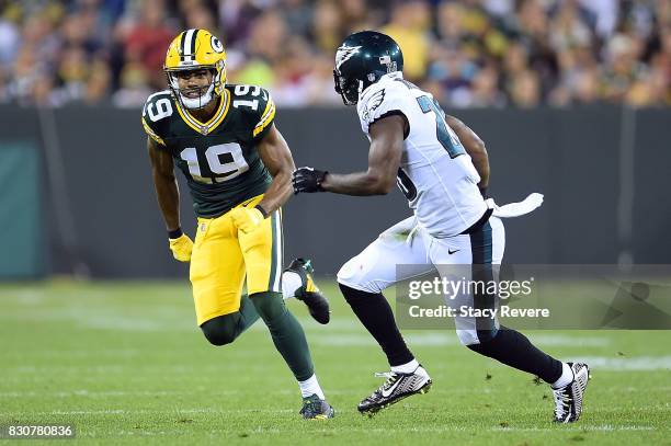 Malachi Dupre of the Green Bay Packers works against Jaylen Watkins of the Philadelphia Eagles during a preseason game at Lambeau Field on August 10,...