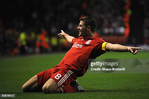 Steven Gerrard of Liverpool celebrates scoring his team's third goal, and his 100th goal for Liverpool during the UEFA Champions League Group D match...