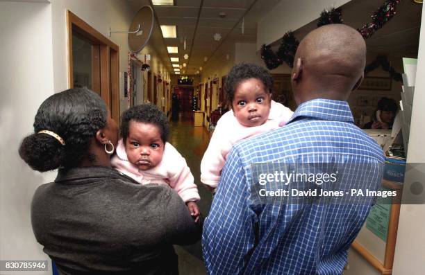 Siamese Twins Eman and Sanchia with parents Emma and David Mowatt, leave the Birmingham Childrens Hospital Monday 24 December following an operation...