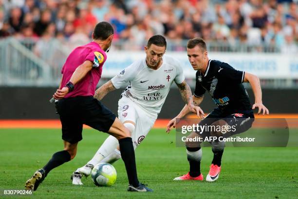 Bordeaux's Danish midfielder Lukas Lerager vies with Metz Metz' French forward Nolan Roux during the French L1 football match Bordeaux vs Metz on...