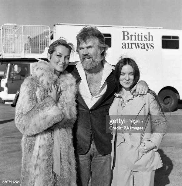 American singing star Kenny Rogers at London's Heathrow airport when he arrived with his two favourite ladies - his bride of a few weeks, television...