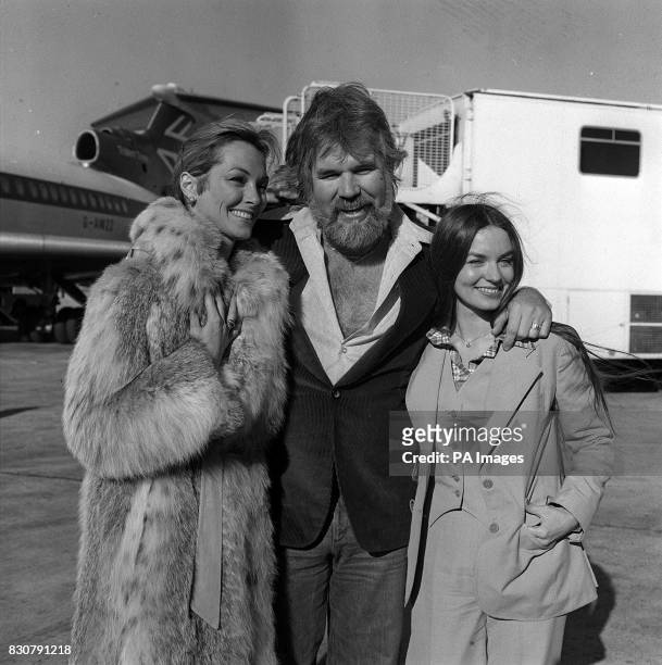 American singing star Kenny Rogers at London's Heathrow airport when he arrived with his two favourite ladies - his bride of a few weeks, television...