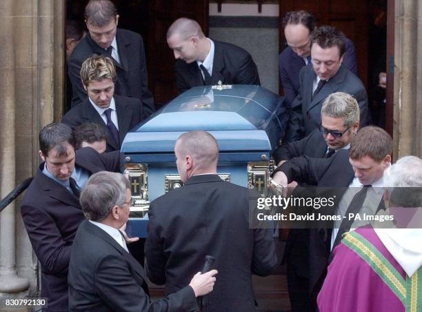 Pop drummer Jon Lee's coffin is carried from St. Mary's Church in Newport, Gwent. Bearers included band members Grant Nicholas , Taka Hirose and band...