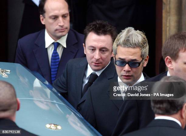 Pop drummer Jon Lee's coffin is carried from St. Mary's Church in Newport, Gwent Friday January 18, 2002. Bearers included band members Taka Hirose...
