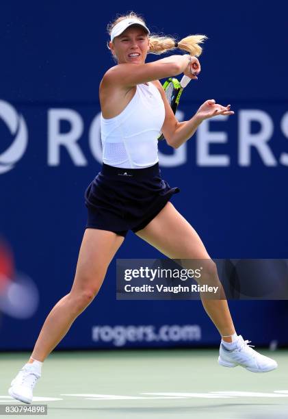 Caroline Wozniacki of Denmark plays a shot against Sloane Stephens of the United States during a semifinal match on Day 8 of the Rogers Cup at Aviva...