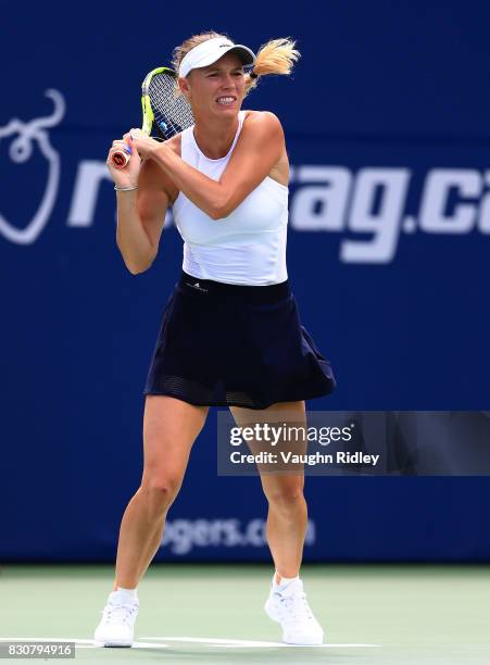 Caroline Wozniacki of Denmark plays a shot against Sloane Stephens of the United States during a semifinal match on Day 8 of the Rogers Cup at Aviva...