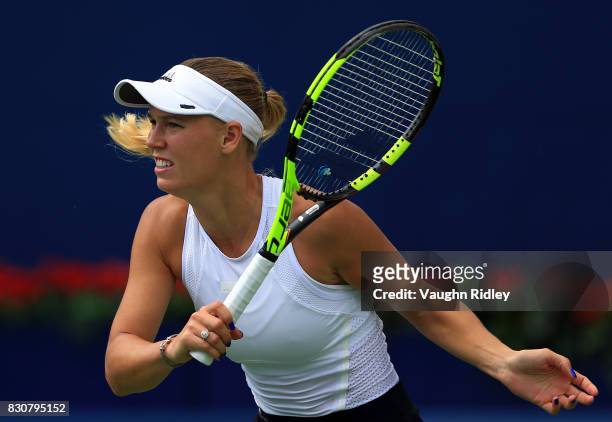 Caroline Wozniacki of Denmark plays a shot against Sloane Stephens of the United States during a semifinal match on Day 8 of the Rogers Cup at Aviva...