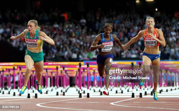 Sally Pearson of Australia, Kendra Harrison of the United States and Nadine Visser of Netherlands cross the finish line in the Women's 100 metres...