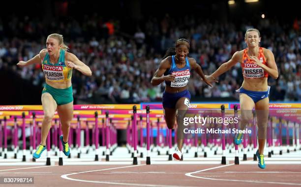 Sally Pearson of Australia leads Kendra Harrison of the United States and Nadine Visser of the Netherlands to the finish line in the Women's 100...