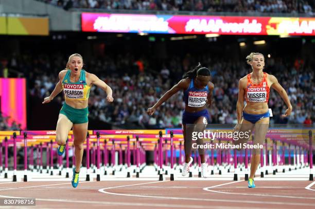 Sally Pearson of Australia leads Kendra Harrison of the United States and Nadine Visser of the Netherlands to the finish line in the Women's 100...