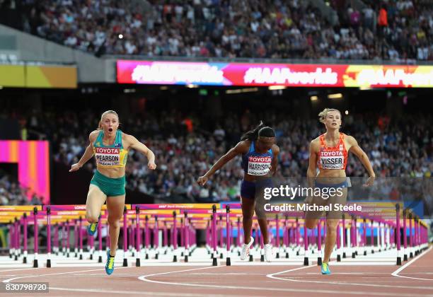 Sally Pearson of Australia leads Kendra Harrison of the United States and Nadine Visser of the Netherlands to the finish line in the Women's 100...