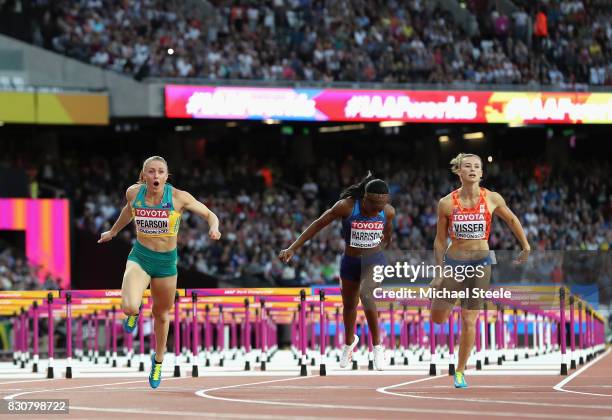 Sally Pearson of Australia, Kendra Harrison of the United States and Nadine Visser of Netherlands cross the finish line in the Women's 100 metres...