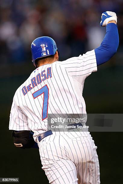 Mark DeRosa of the Chicago Cubs celebrates as he runs the bases on his 2-run home run in the bottom of the second inning against the Los Angeles...