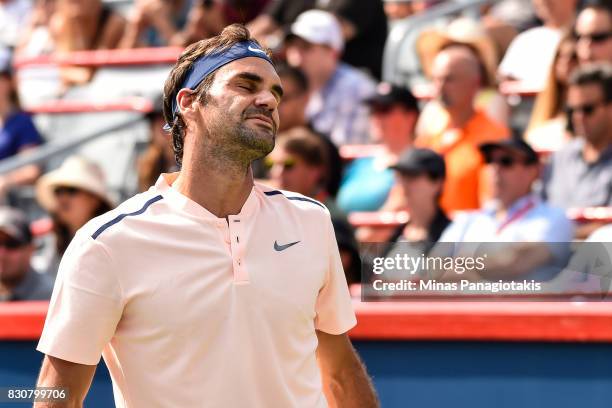 Roger Federer of Switzerland reacts after losing a point against Robin Haase of Netherlands during day nine of the Rogers Cup presented by National...